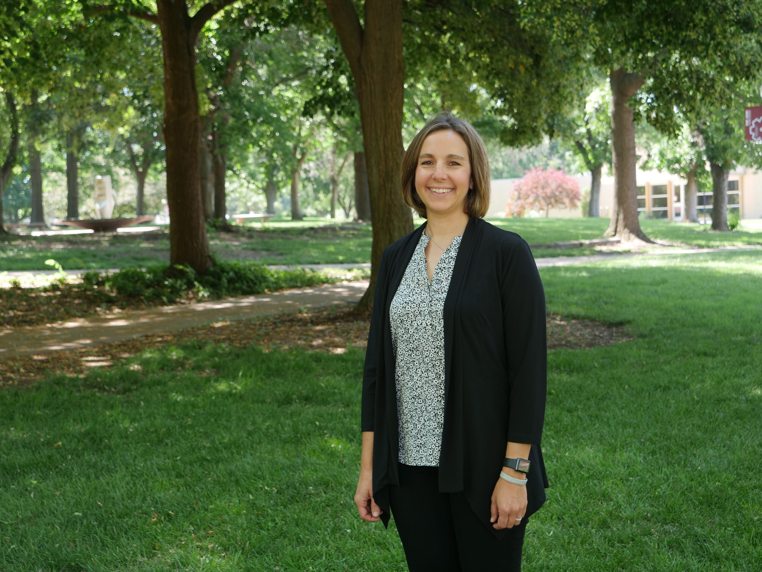 Photo of Becky Bartell standing on the Green
