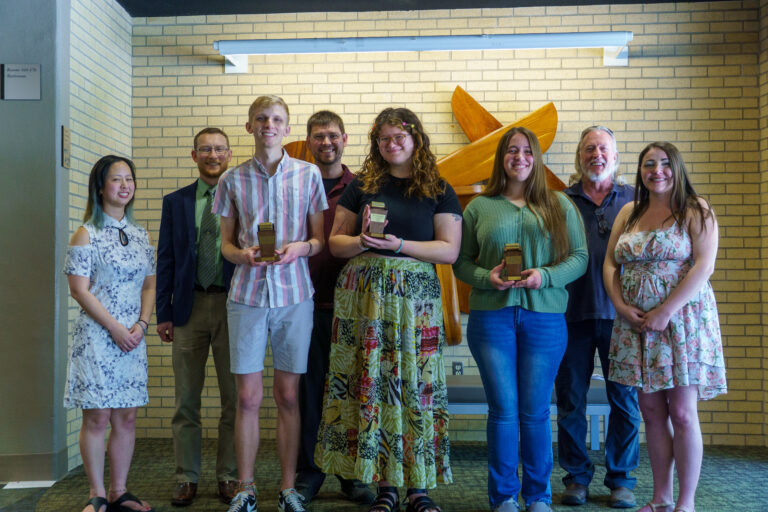 Thresher Awards: In front, from left, Peter Buller, Emil Benavides, Gracie Higgins. Faculty from left, Dr. Christina Liu, Peter Goerzen, Dr. Trent Voth, David Long, Dr. Cristy Dougherty