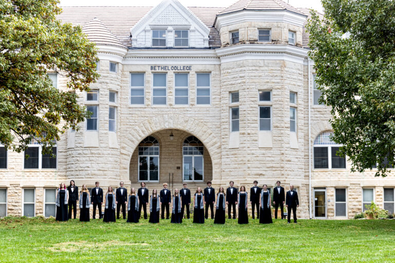 Chamber Singers standing in front of the Ad Building