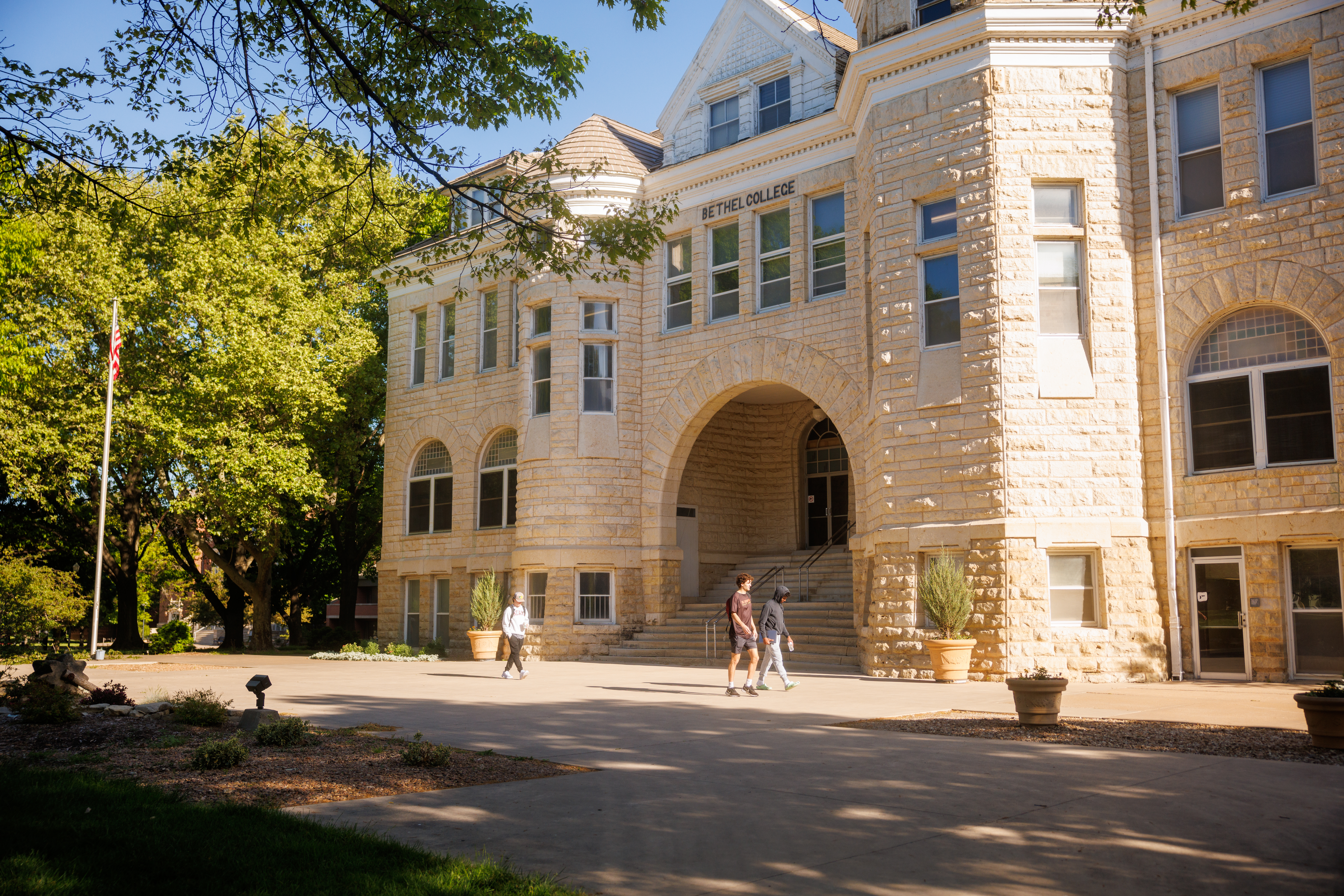 People walking in front of the Administration Building on a sunny day